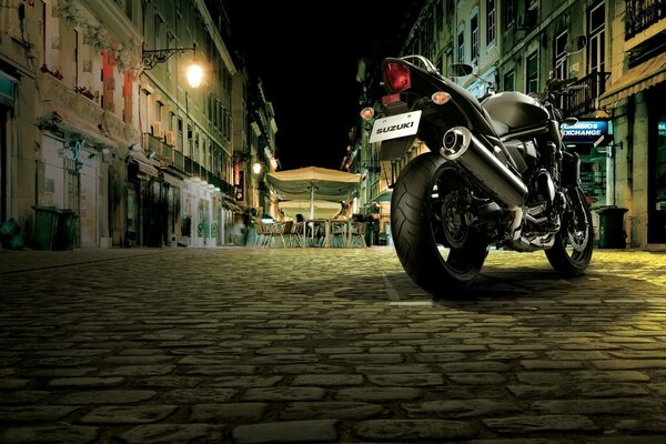 Motorcycle on the street against the background of a cafe