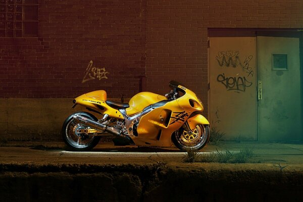 Yellow motorcycle next to the door