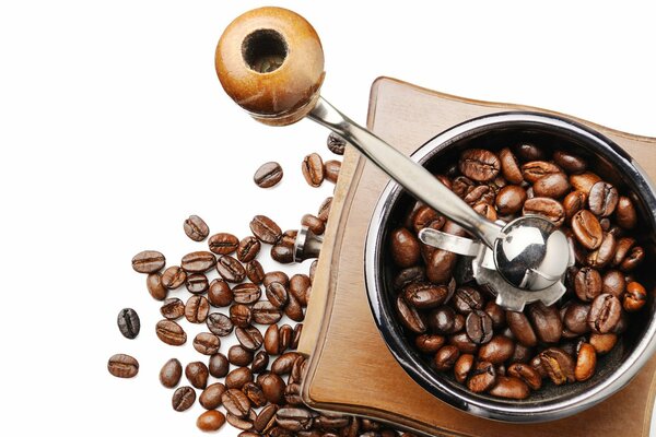 Open mechanical coffee grinder with coffee beans