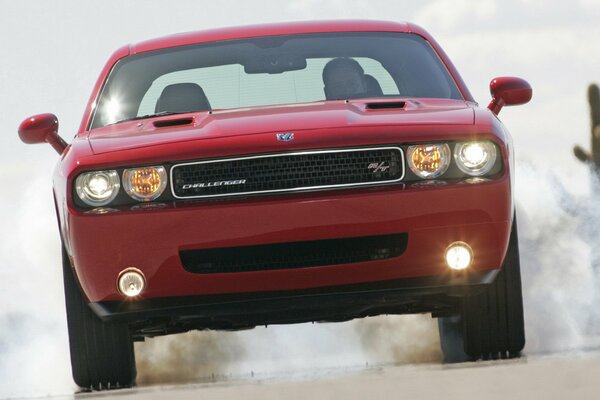 Red dodge challenger at speed