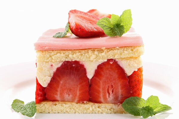 A piece of strawberry cake decorated with mint