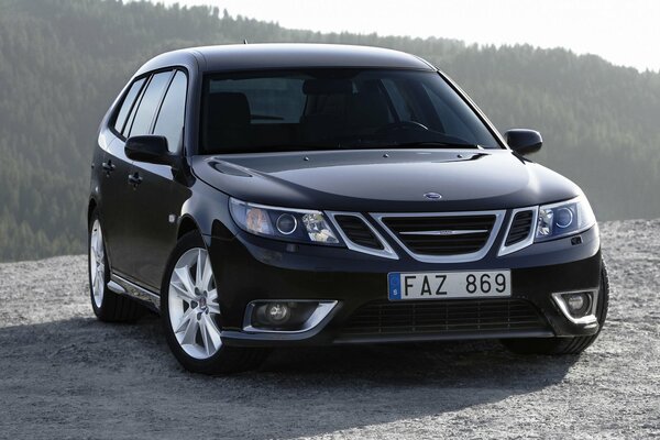 Black, charismatic saab with aggressive soot and beautiful discs