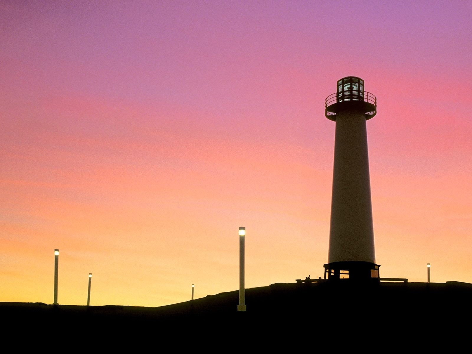 faro puesta de sol linternas