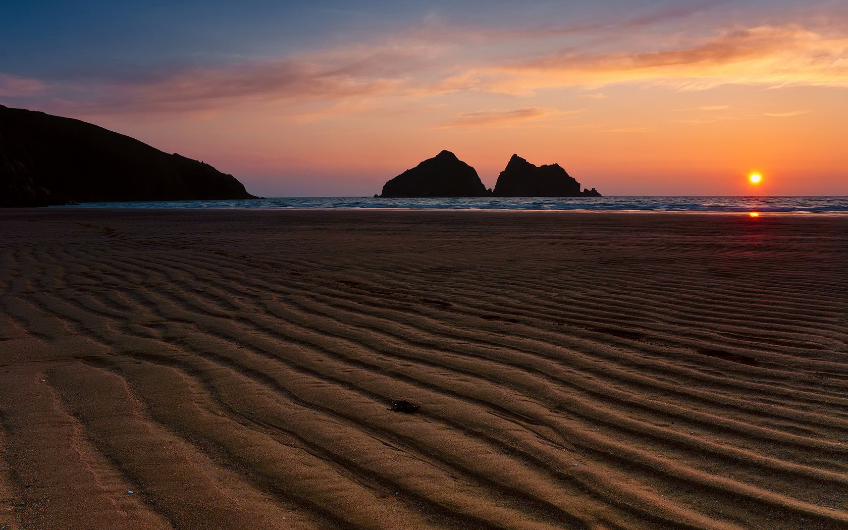 mare sagome rocce spiaggia tramonto