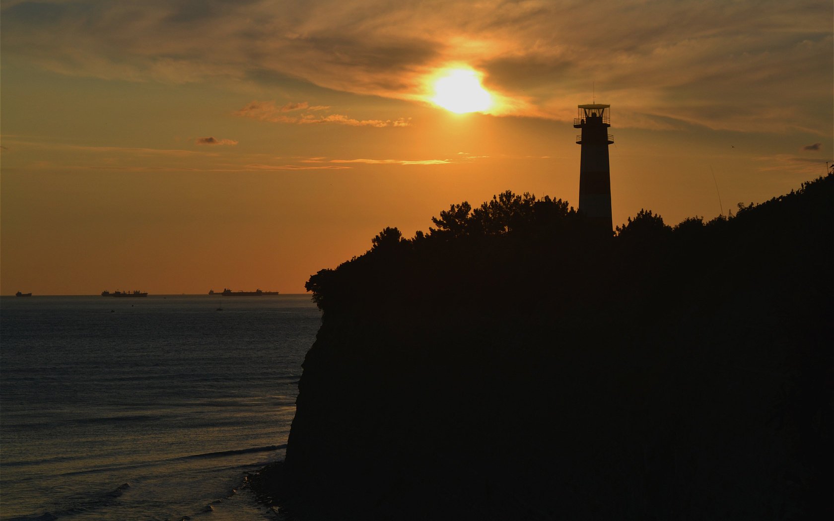 coucher de soleil phare nature mer