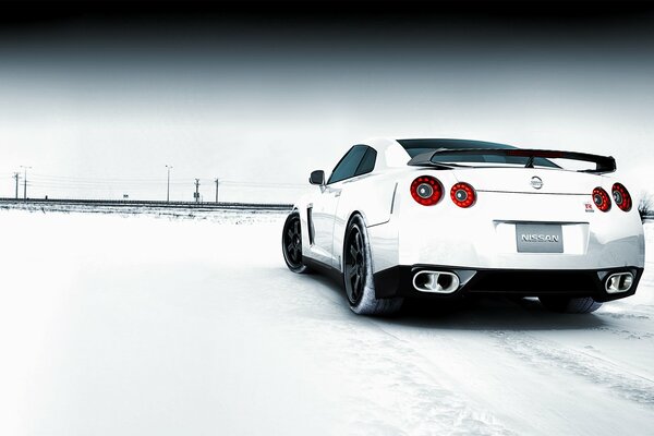 White car on a snowy field