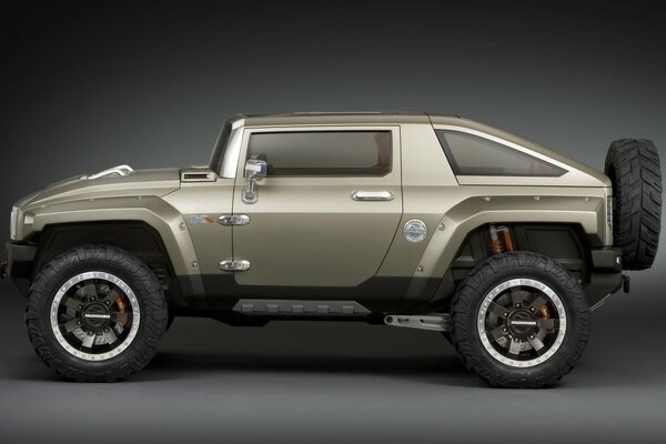 A light brown Jeep car on a dark gray background