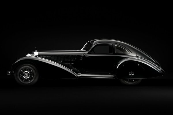 Black Mercedes retro style car on black background