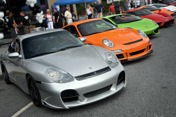 Porsche Ferrari sports cars at the exhibition