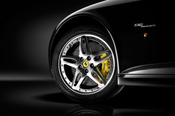 Car wheel on black background