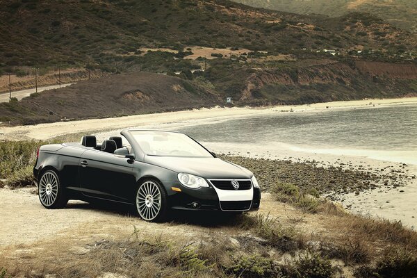 In the steppe on an open-top Volkswagen