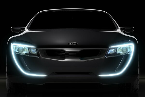 Kia concept in dark color and bright headlights