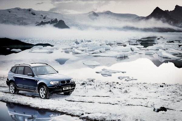 A large SUV on a snowy road