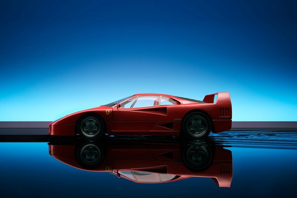 Roter Ferrari F40 mit Reflexion im blauen Wasser