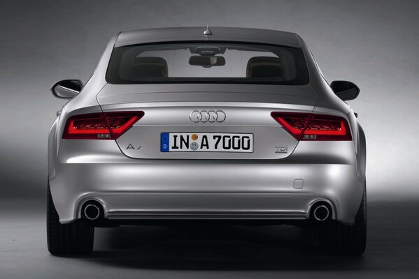 The rear of a silver Audi A7 with a European license plate