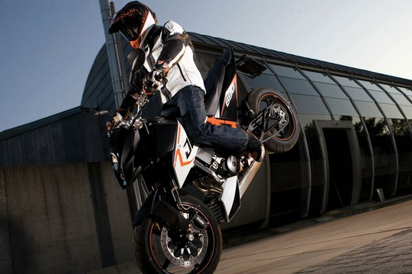 A stoppie trick on a Super Duke bike