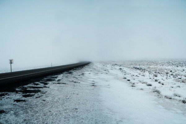 Winter road. A raging blizzard