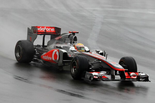 Formula one car in the rain
