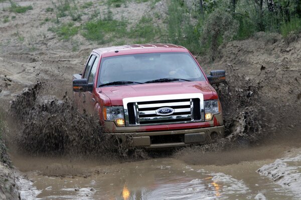 Red Ford confidently passes off-road 