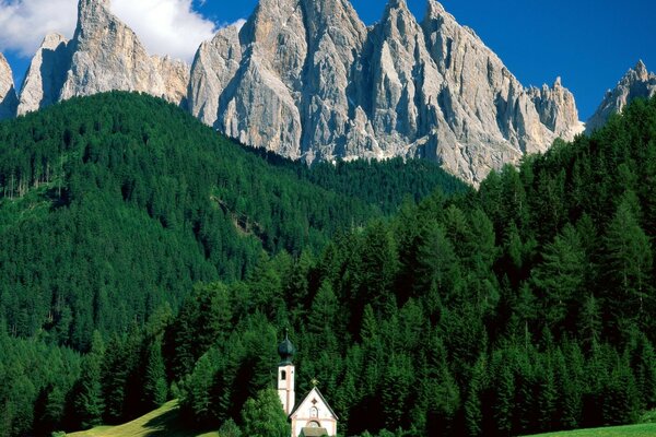 A small chapel near a beautiful mountain