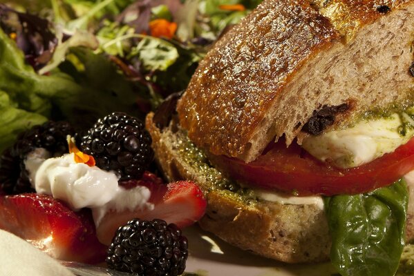 Photo of bread from a sandwich next to berries