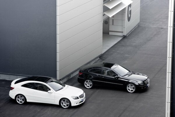 Black and white Mercedes on a gray background