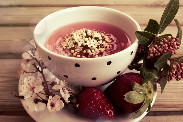 Tea mug decorated with sakura and strawberries