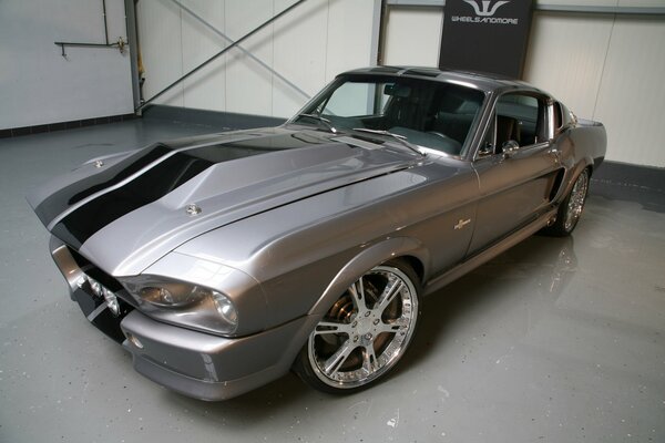 Grey Ford sports car with black stripes