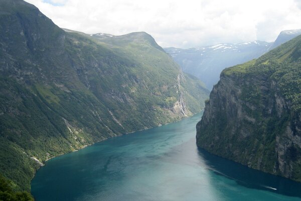 The river passes between two large mountains