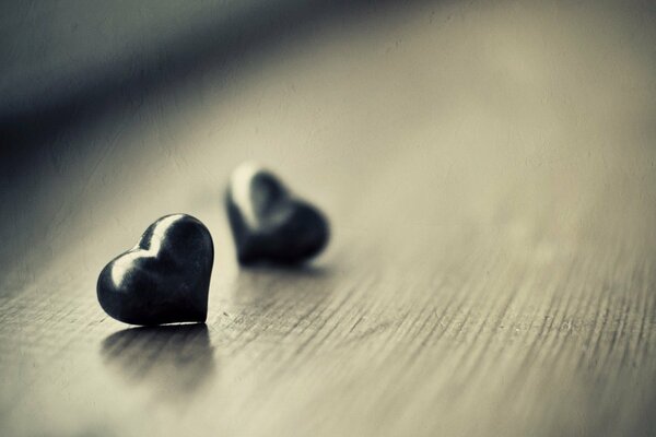 Two hearts of stone on the table macro shooting