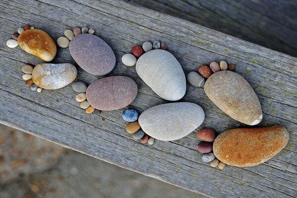 Funny figures of pebbles in the shape of feet