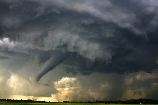 A strong storm turns into a tornado on the field