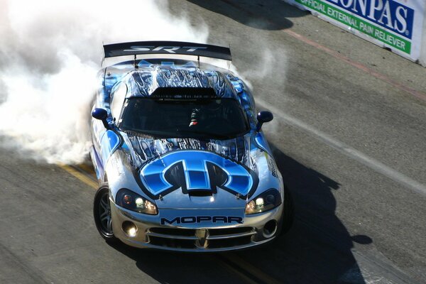 A sports car drifts at competitions