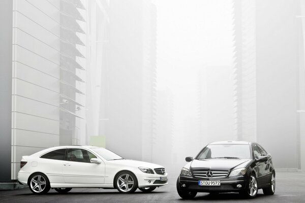 Two Mercedes, black and white