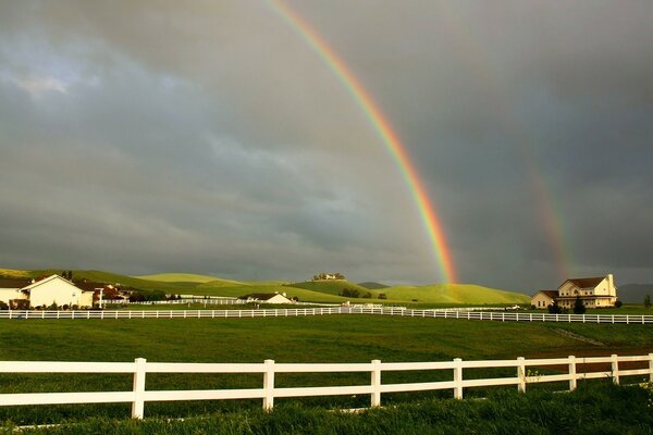 Beautiful landscape with a field and a rainbow