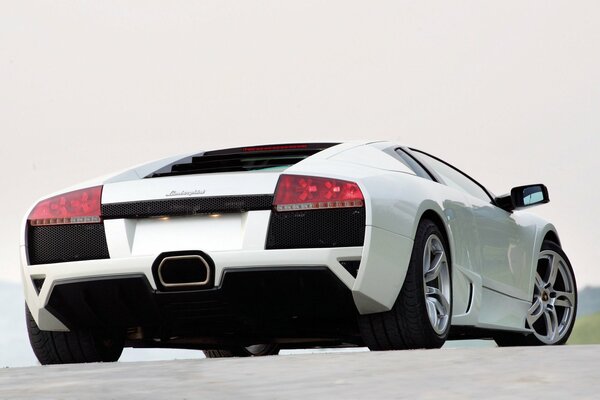 White Lamborghini Murcielago with red headlights