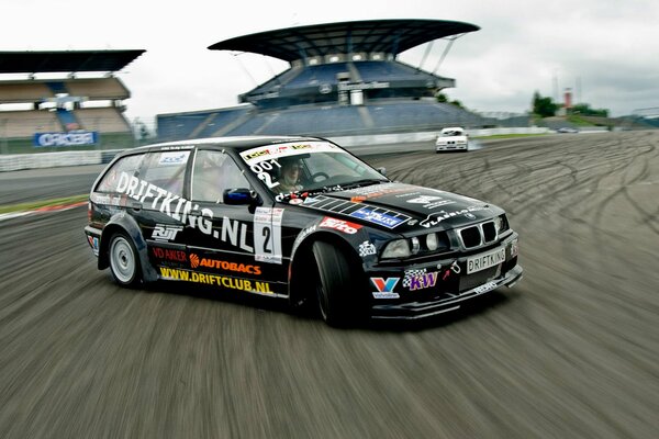 BMW car in a skid on the race track