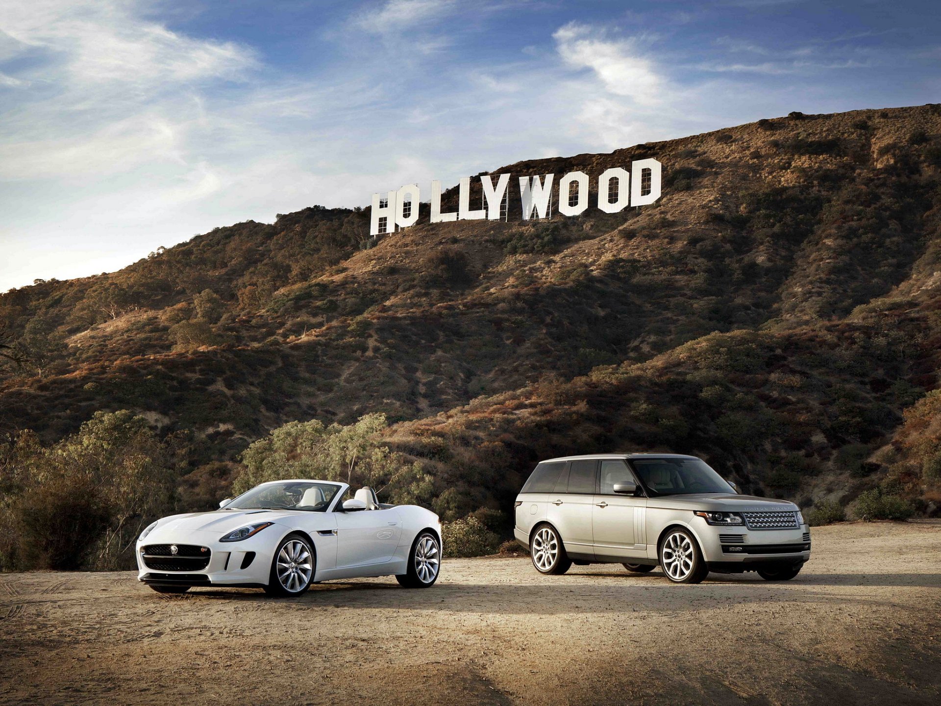 jaguar f-type white and land rover range rover