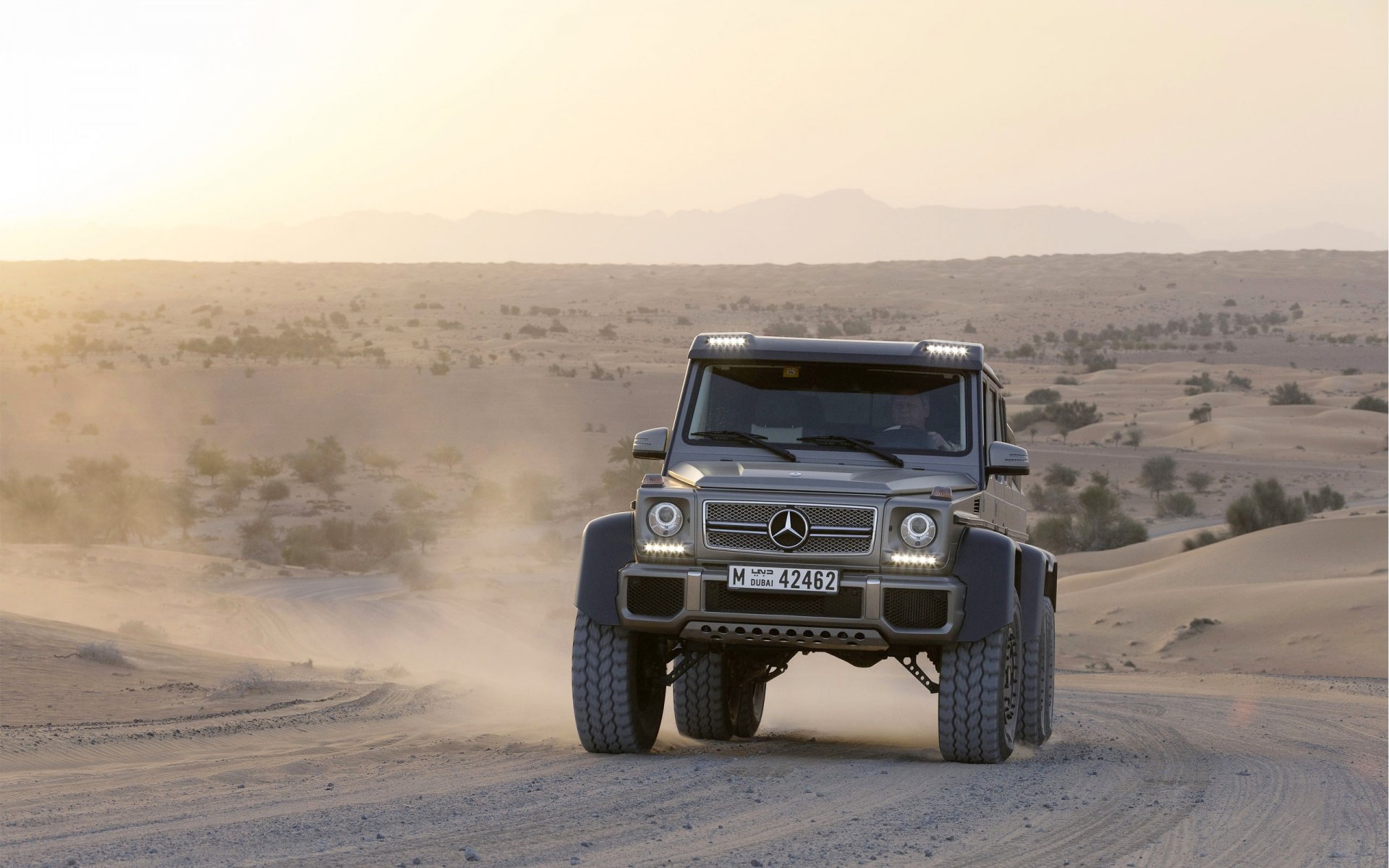 mercedes-benz g63 amg 6x6 suv desert in motion front sand