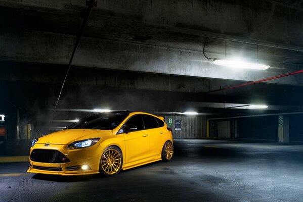 Yellow Ford focus in the parking lot