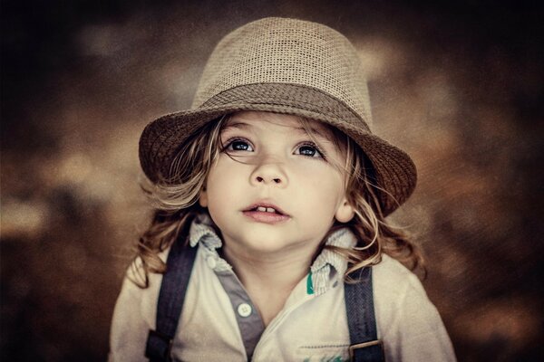 Portrait of a little girl in a hat