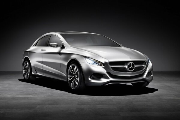 Black and white photo of a Mercedes on a dark background