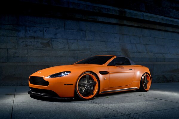 Orange Aston Martin auto