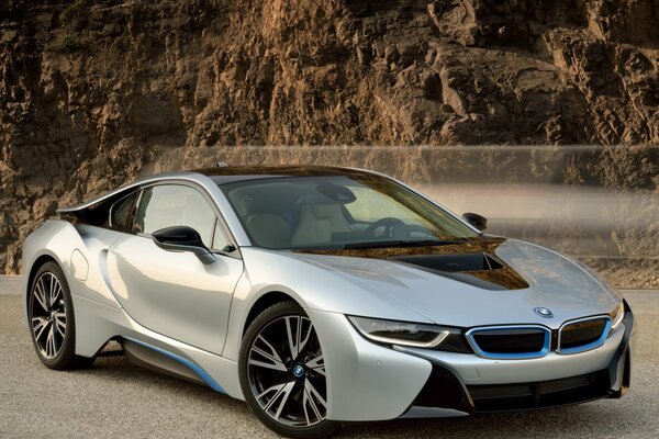 Silver car on the background of mountains