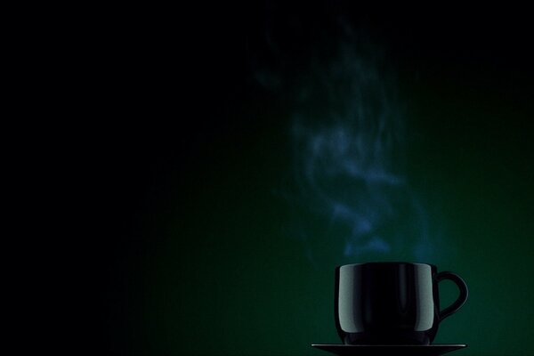 A cup of hot drink on a dark background