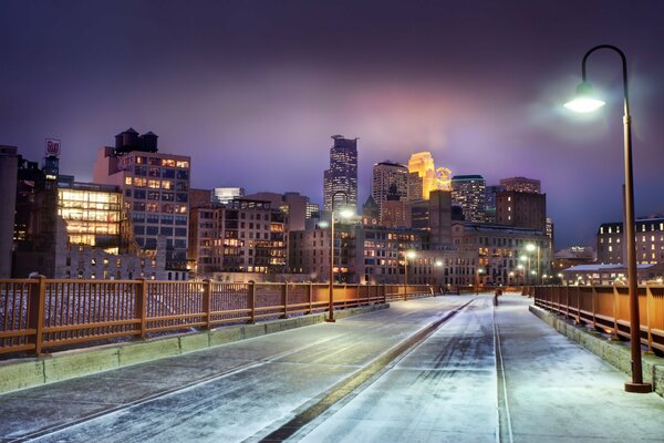 Snow-covered road under a streetlight in Minnesota