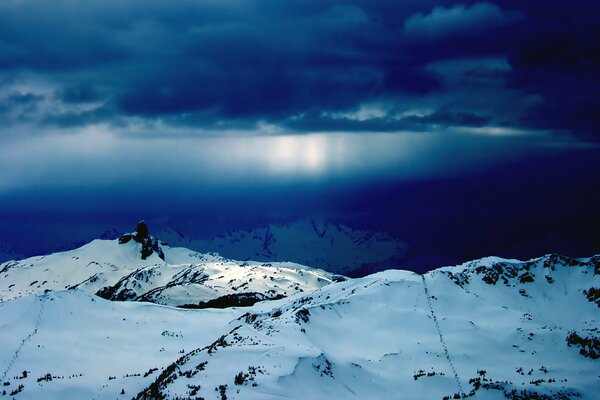 Mountains in dark snow