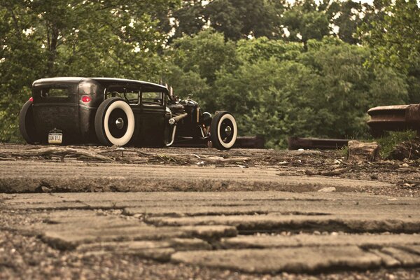 Ford Mustang model A on the background of the forest