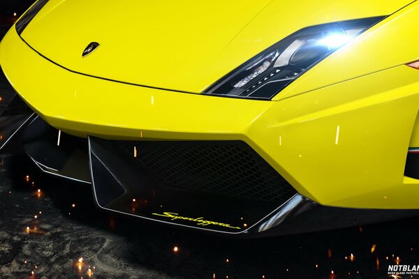 Yellow lamborghini bumper with shiny headlights