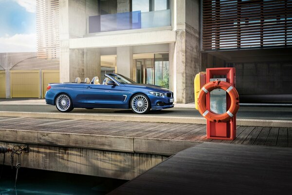 Chic blue bmw alpina b4 convertible, in the rays of light